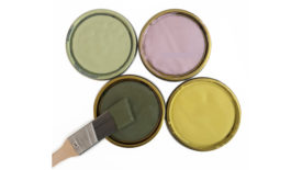 图像的四个与米勒漆油漆罐盖子2022年春季的颜色,包括苔绿色、黄绿色,玫瑰红,淡绿色。